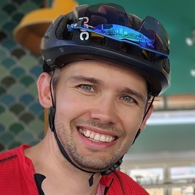Ivan Agafonov in a cycling helmet, smiling